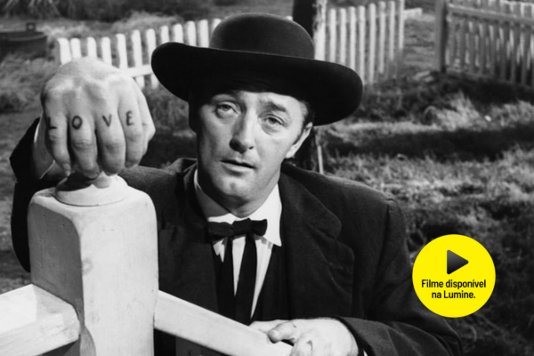 Robert Michum em cena do filme "O mensageiro do diabo", de Charles Laughton.